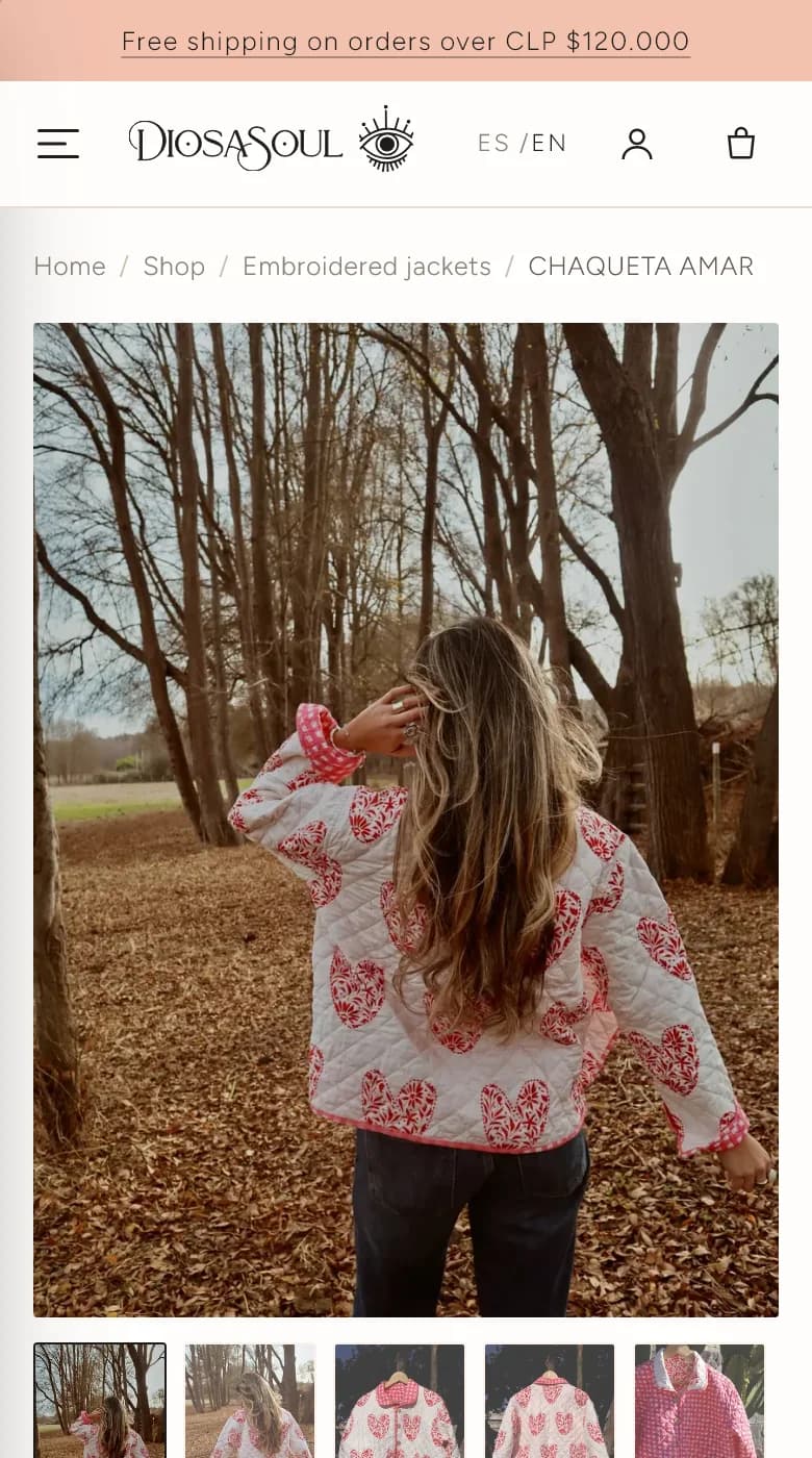 Diosa Soul's product page on a phone: a quilted heart jacket, worn among bare trees