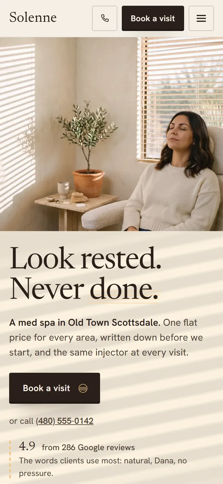 Solenne's home page on a phone: a client resting by a window, with Book a visit at the top